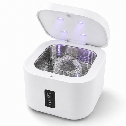 White U-Brightwave ultrasonic cleaner with the lid open on a plain white background, showing a clear aligner tray in the water basin.
